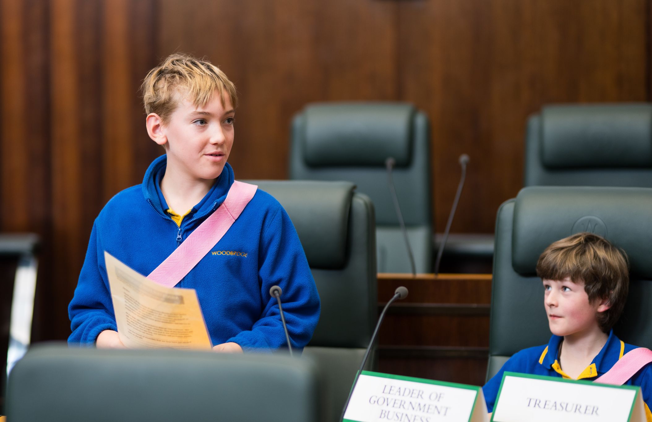 Photo of two school students participating in a role play at Parliament House