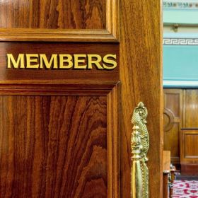 Wooden door leading into the Legislative Council chamber, Hobart, with the word 'Members' in gold
