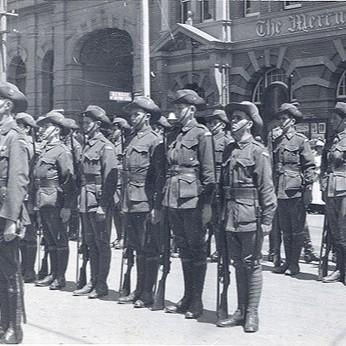 Black and white photo of WW1 inspection of troops outside The Mercury newspaper building, Hobart