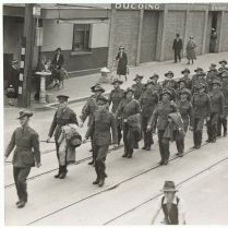 Black and white photo of WW2 troops marching in a Launceston street