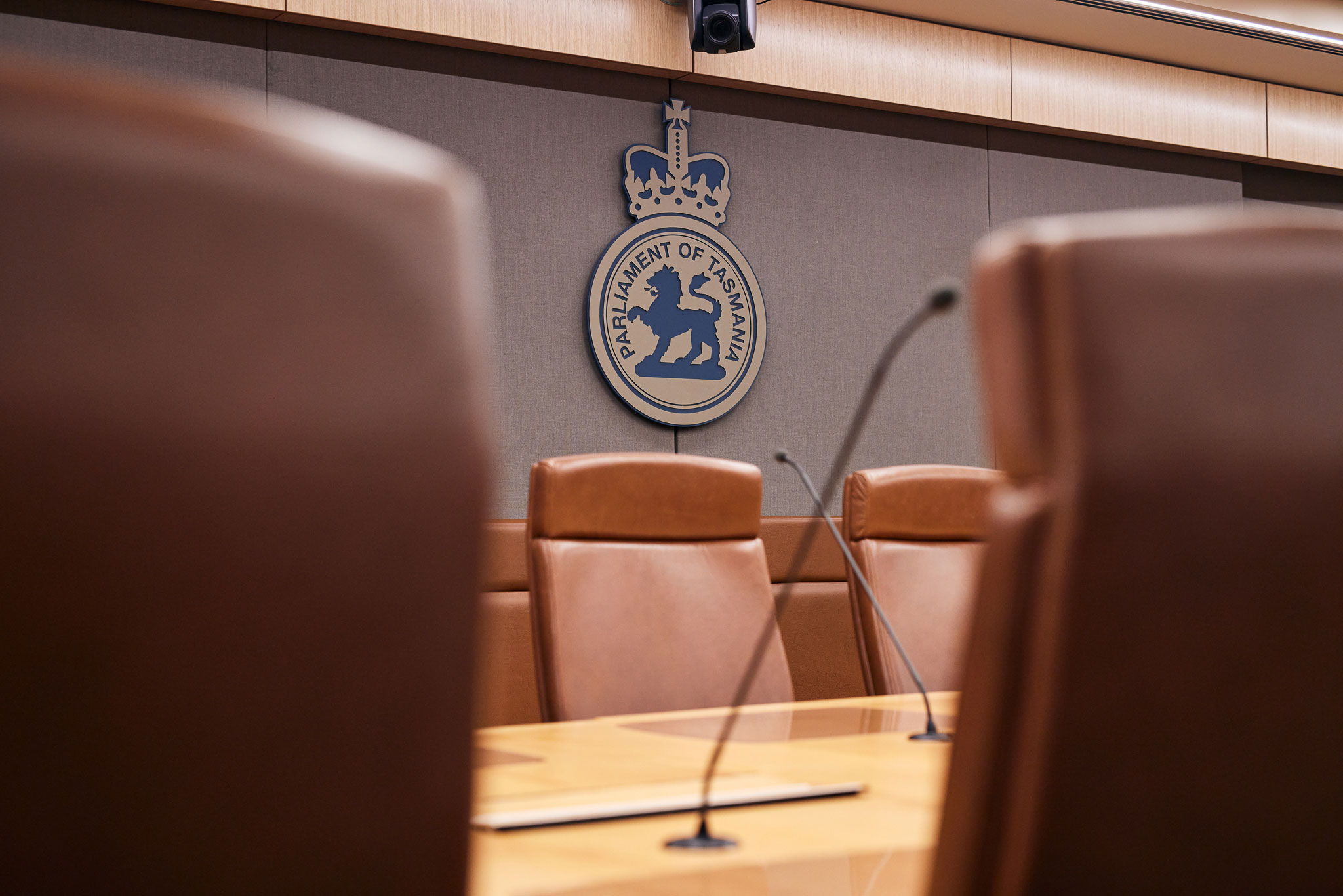 Close up photo of a Committee Room table and chairs in Parliament House, Hobart, taken 2022